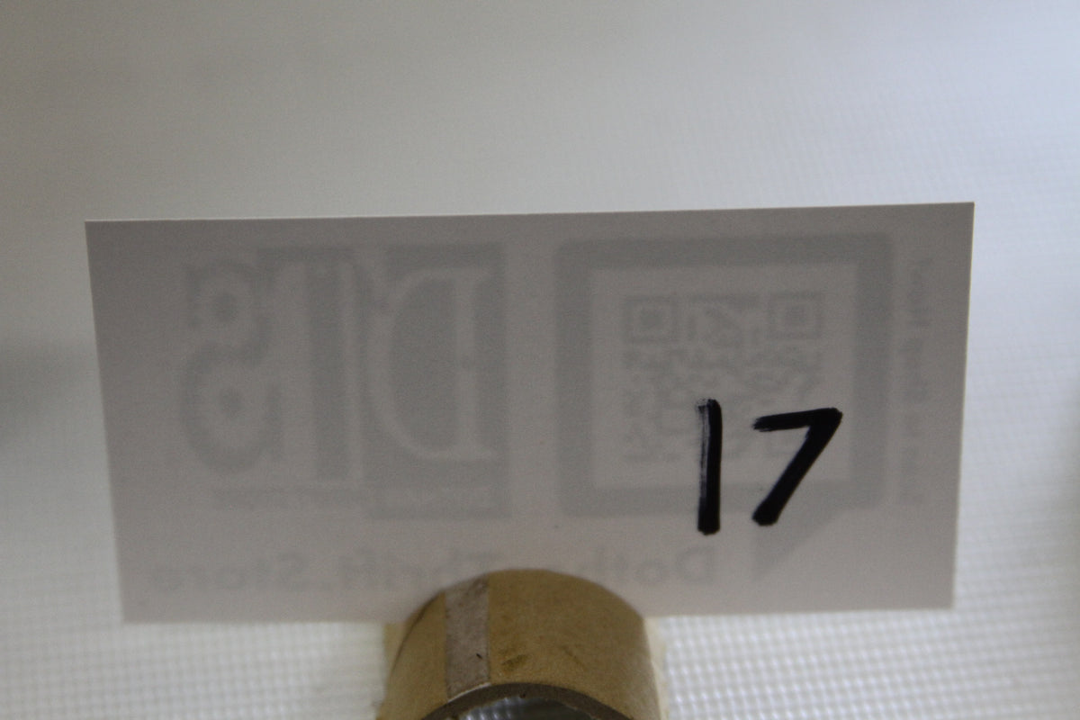 Number card with handwritten 17 in front of the product