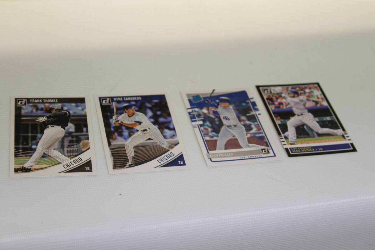 Donruss baseball cards of Frank Thomas, Ryne Sandberg, Gavin Lux, and Max Muncy