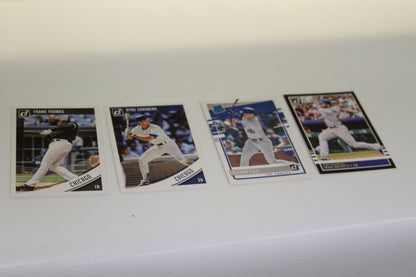 Donruss baseball cards of Frank Thomas, Ryne Sandberg, Gavin Lux, and Max Muncy